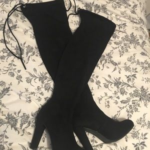 Black thigh high over the knee boots wth tie back